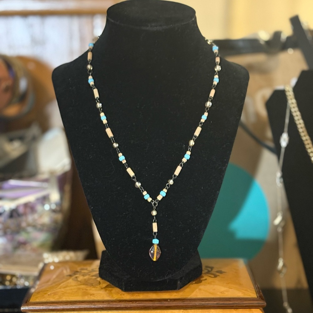 Gunmetal chain with glass and wooden beads18” long at its largest.